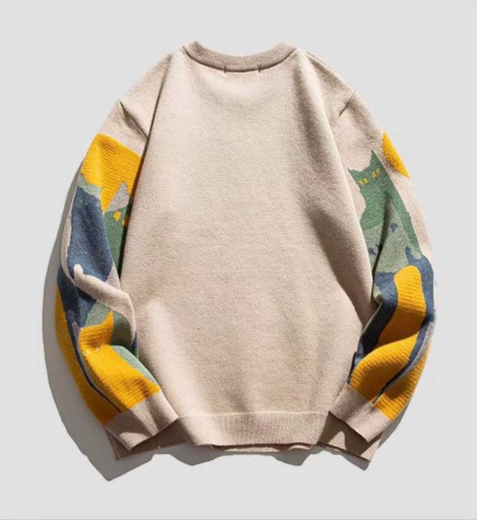A cozy sweater featuring vibrant sleeves with a yellow and blue design, perfect for a chill vibe.