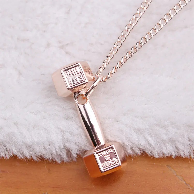 "EuroFit Dumbbell Necklace: Stylish Titanium Barbell Pendant for Fitness Lovers in USA & Canada" Roljord